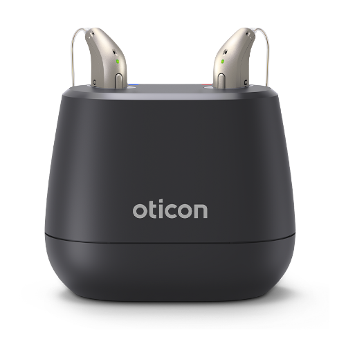 Oticon Intent charger with a pair of hearing aids plugged in